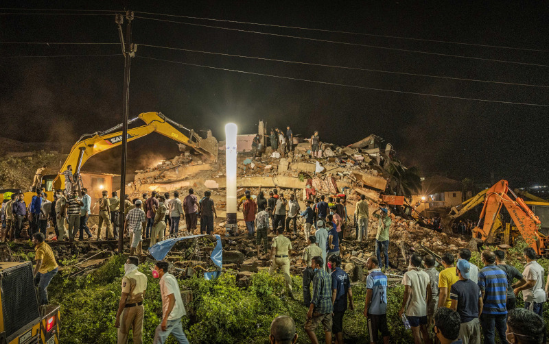 Rescue workers look for survivors after a residential building collapsed in Mahad, about 170 kilometers (105 miles) from India's financial capital of Mumbai, Monday, Aug. 24, 2020. Many people feared injured and more than 65 were trapped inside after a residential building caved in on Monday evening in the central Indian state of Maharashtra. (AP Photo)