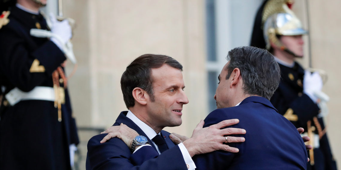 French President Emmanuel Macron welcomes Greek Prime Minister Kyriakos Mitsotakis at the Elysee Palace in Paris, France January 29, 2020. REUTERS/Benoit Tessier