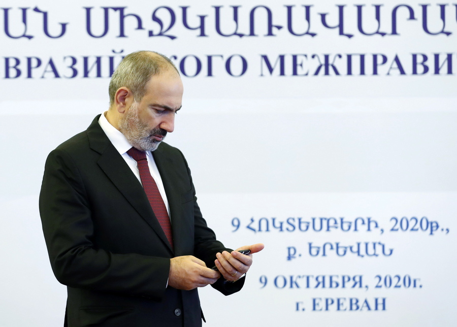 epa08731190 Armenian Prime Minister Nikol Pashinyan waits to greet heads of delegation before a meeting of the Eurasian Economic Union (EAEU or EEU) intergovernmental council in Yerevan, Armenia, 09 October 2020. The ongoing armed conflict in Nagorno Karabakh is expected to top the meeting's agenda. A military conflict continues since armed clashes erupted on 27 September 2020 in the simmering territorial conflict between Azerbaijan and Armenia over the Nagorno-Karabakh territory along the contact line of the self-proclaimed Nagorno-Karabakh Republic (also known as Artsakh).  EPA/DMITRY ASTAKHOV / SPUTNIK / GOVERNMENT PRESS SERVICE POOL / POOL MANDATORY CREDIT  EPA-EFE/DMITRY ASTAKHOV / SPUTNIK / GOVERNMENT PRESS SERVICE POOL / POOL MANDATORY CREDIT