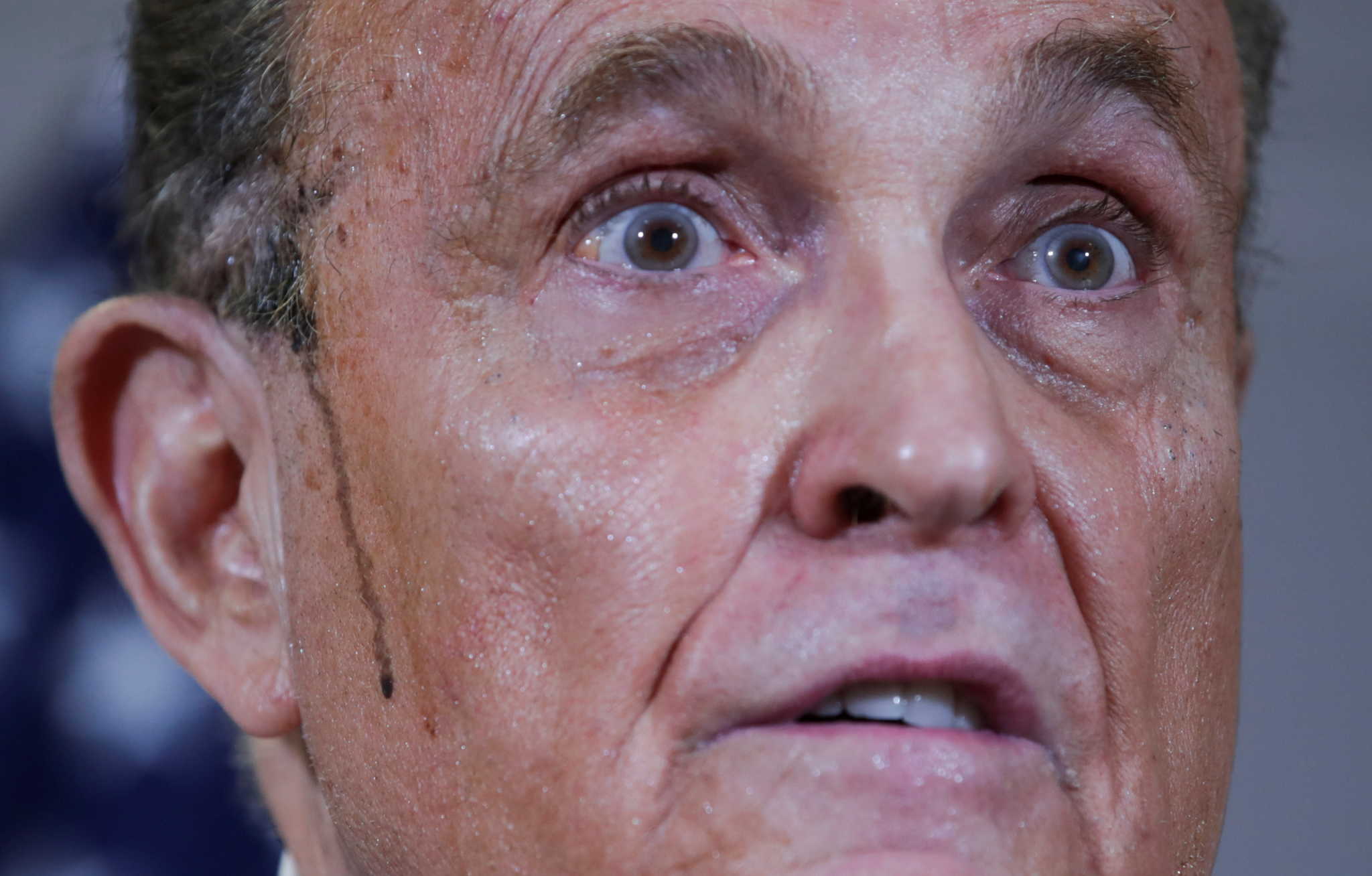 Former New York City Mayor Rudy Giuliani, personal attorney to U.S. President Donald Trump, speaks as sweat runs down his cheek during a news conference about the 2020 U.S. presidential election results held at Republican National Committee headquarters in Washington, U.S., November 19, 2020. REUTERS/Jonathan Ernst