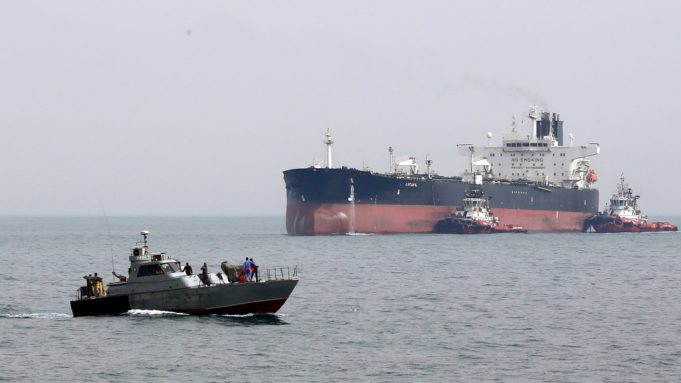 epa05844552 A military boat patrols next to the Artavil oil tanker, at the Kharg Island, in Persian Gulf, southern Iran, 12 March 2017. According to estimates, Kharg oil terminal handles 98 percent of Iran's crude exports.  EPA/ABEDIN TAHERKENAREH