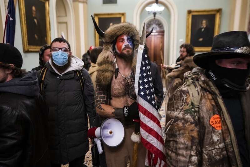 epa08923449 Supporters of US President Donald J. Trump gather outside of the Senate chamber after they breached the US Capitol security in Washington, DC, USA, 06 January 2021. Protesters stormed the US Capitol where the Electoral College vote certification for President-elect Joe Biden took place. EPA/JIM LO SCALZO