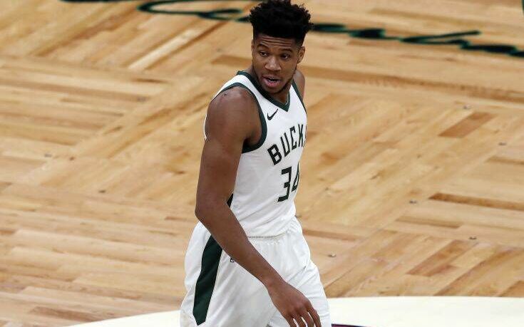 Milwaukee Bucks' Giannis Antetokounmpo plays against the Boston Celtics during the first half of an NBA basketball game, Wednesday, Dec. 23, 2020, in Boston. (AP Photo/Michael Dwyer)