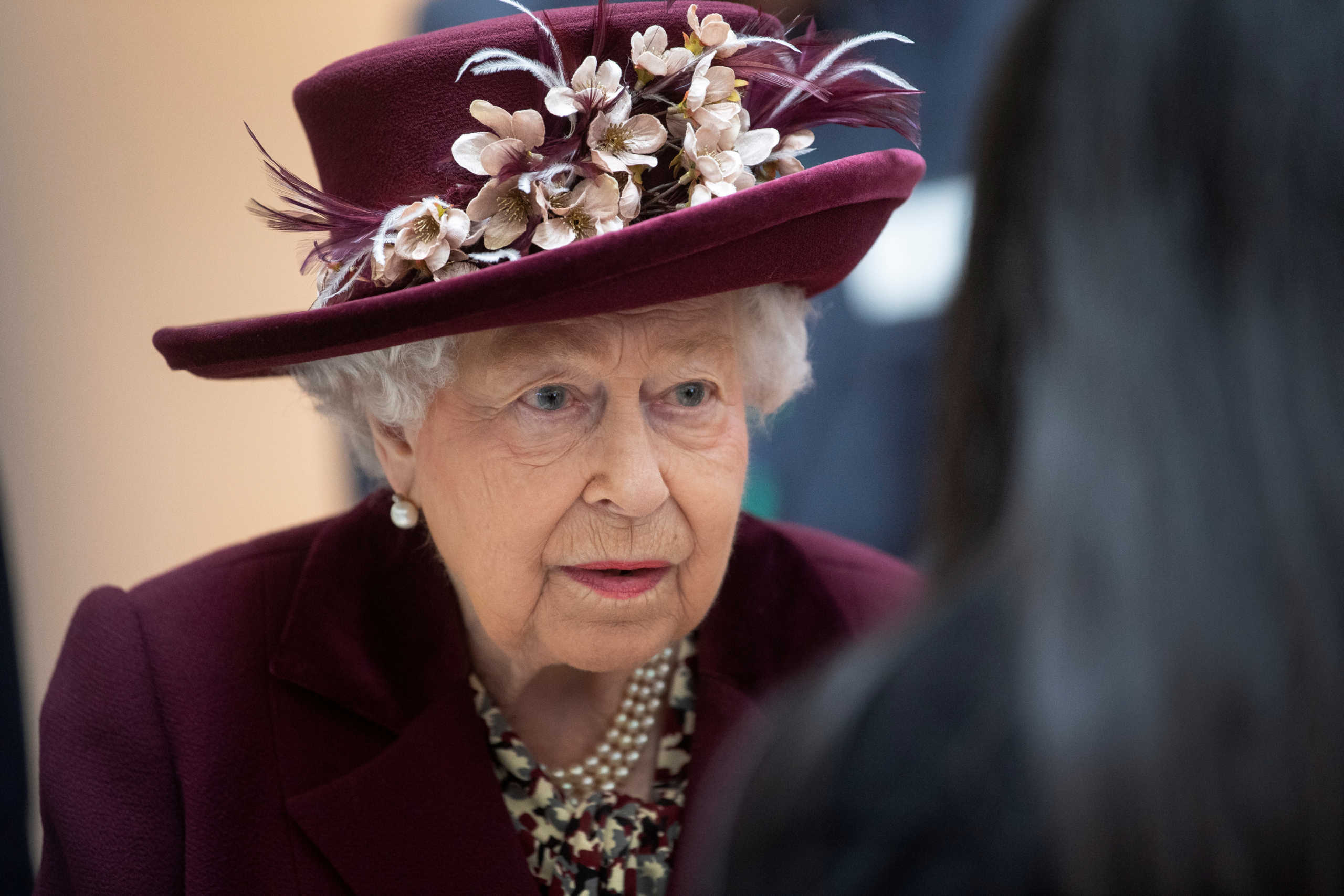 Britain's Queen Elizabeth II talks with MI5 officers during a visit to the headquarters of MI5, which is the United Kingdom's domestic counter-intelligence and security agency, at Thames House in London, Britain February 25, 2020. Victoria Jones/PA Wire/Pool via REUTERS