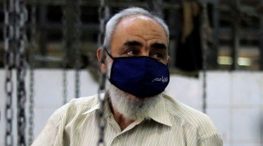 An Egyptian man wears a protective mask reads "Long live to Egypt" and looks at his slaughtered sacrificial cow inside a slaughterhouse during celebrations marking the Muslim holiday of Eid al-Adha amid the spread of the coronavirus disease (COVID-19) in Cairo, Egypt, July 31, 2020. REUTERS/Amr Abdallah Dalsh