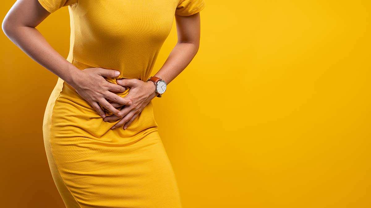 Woman suffers from stomach ache Close up