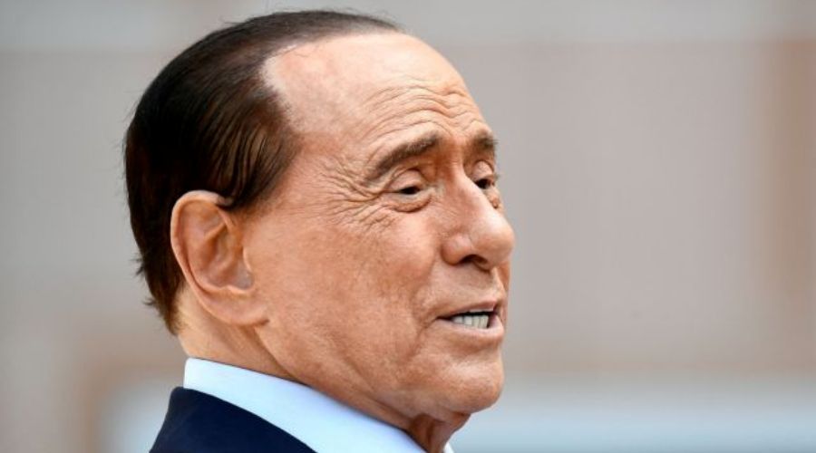 FILE PHOTO: Former Italian Prime Minister Silvio Berlusconi speaks to the media as he leaves Milan's San Raffaele hospital, where he was being treated after testing positive for the coronavirus disease (COVID-19) and diagnosed with mild pneumonia, in Milan, Italy, September 14, 2020. REUTERS/Flavio Lo Scalzo/File Photo