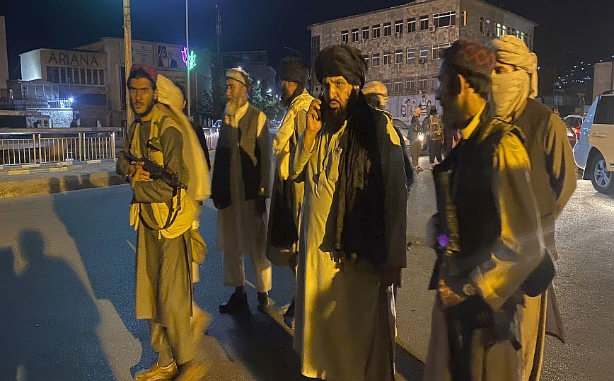 Taliban fighters take control of Afghan presidential palace after the Afghan President Ashraf Ghani fled the country, in Kabul, Afghanistan, Sunday, Aug. 15, 2021. (AP Photo/Zabi Karimi)