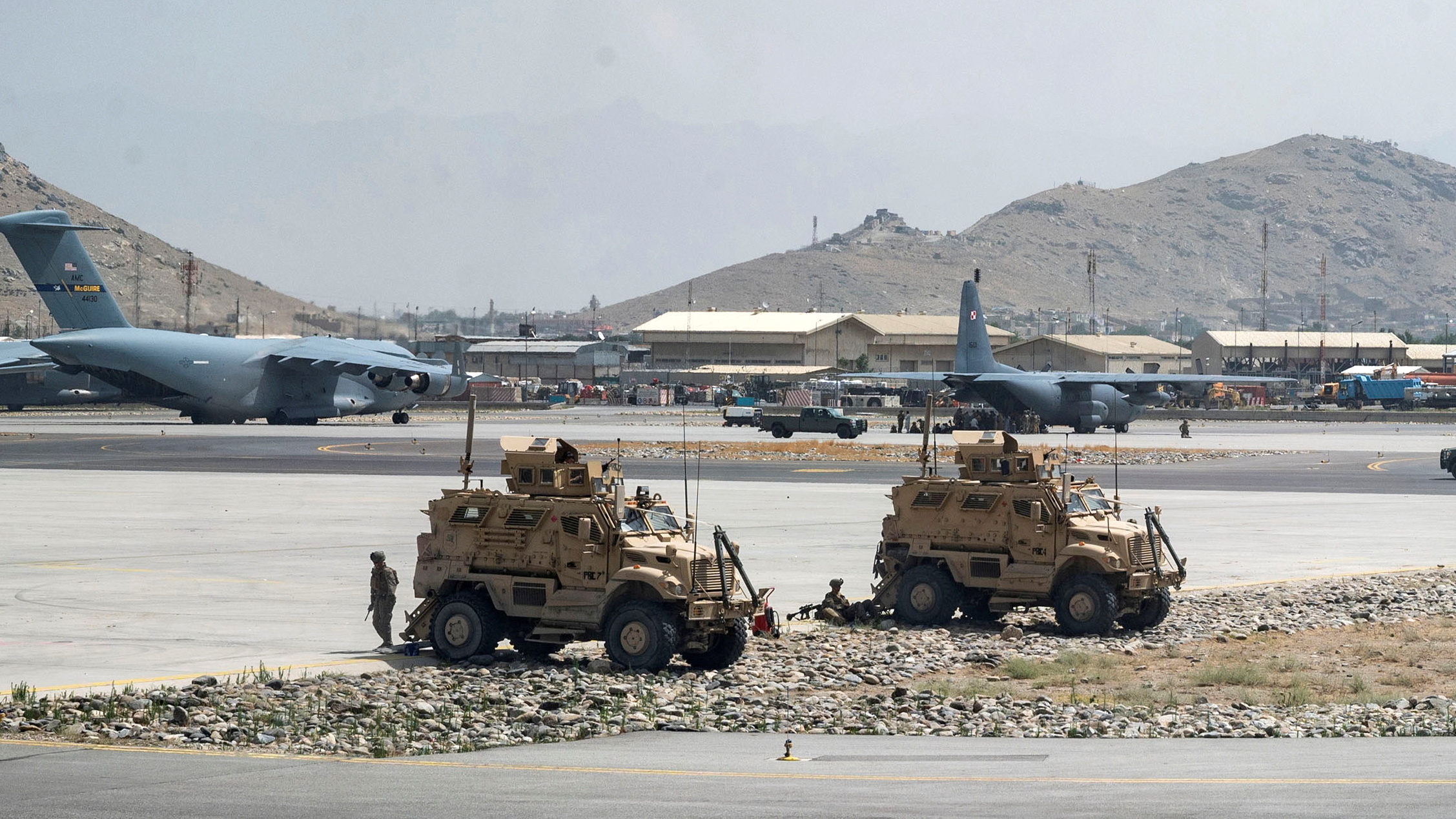 FILE PHOTO: U.S. Army soldiers assigned to the 82nd Airborne Division patrol Hamid Karzai International Airport in Kabul, Afghanistan August 17, 2021. Picture taken August 17, 2021.  U.S. Air Force/Senior Airman Taylor Crul/Handout via REUTERS  THIS IMAGE HAS BEEN SUPPLIED BY A THIRD PARTY. THIS PICTURE WAS PROCESSED BY REUTERS TO ENHANCE QUALITY. AN UNPROCESSED VERSION HAS BEEN PROVIDED SEPARATELY./File Photo