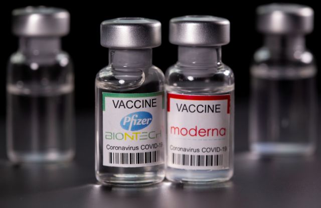 FILE PHOTO: Vials with Pfizer-BioNTech and Moderna coronavirus disease (COVID-19) vaccine labels are seen in this illustration picture taken March 19, 2021. REUTERS/Dado Ruvic/Illustration/File Photo