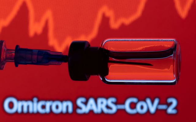 FILE PHOTO: A vial and a syringe are seen in front of a displayed stock graph and words "Omicron SARS-CoV-2" in this illustration taken, November 27, 2021. REUTERS/Dado Ruvic/Illustration/File Photo