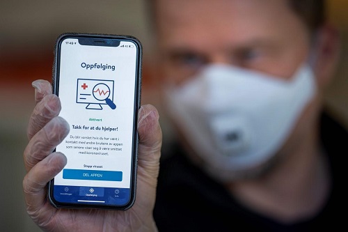 A phone shows a tracking and tracing app launched by Norway's National Institute of Public Health to try to halt a return of the new coronavirus, on April 17 in Oslo. The country is starting to lift lockdown measures.