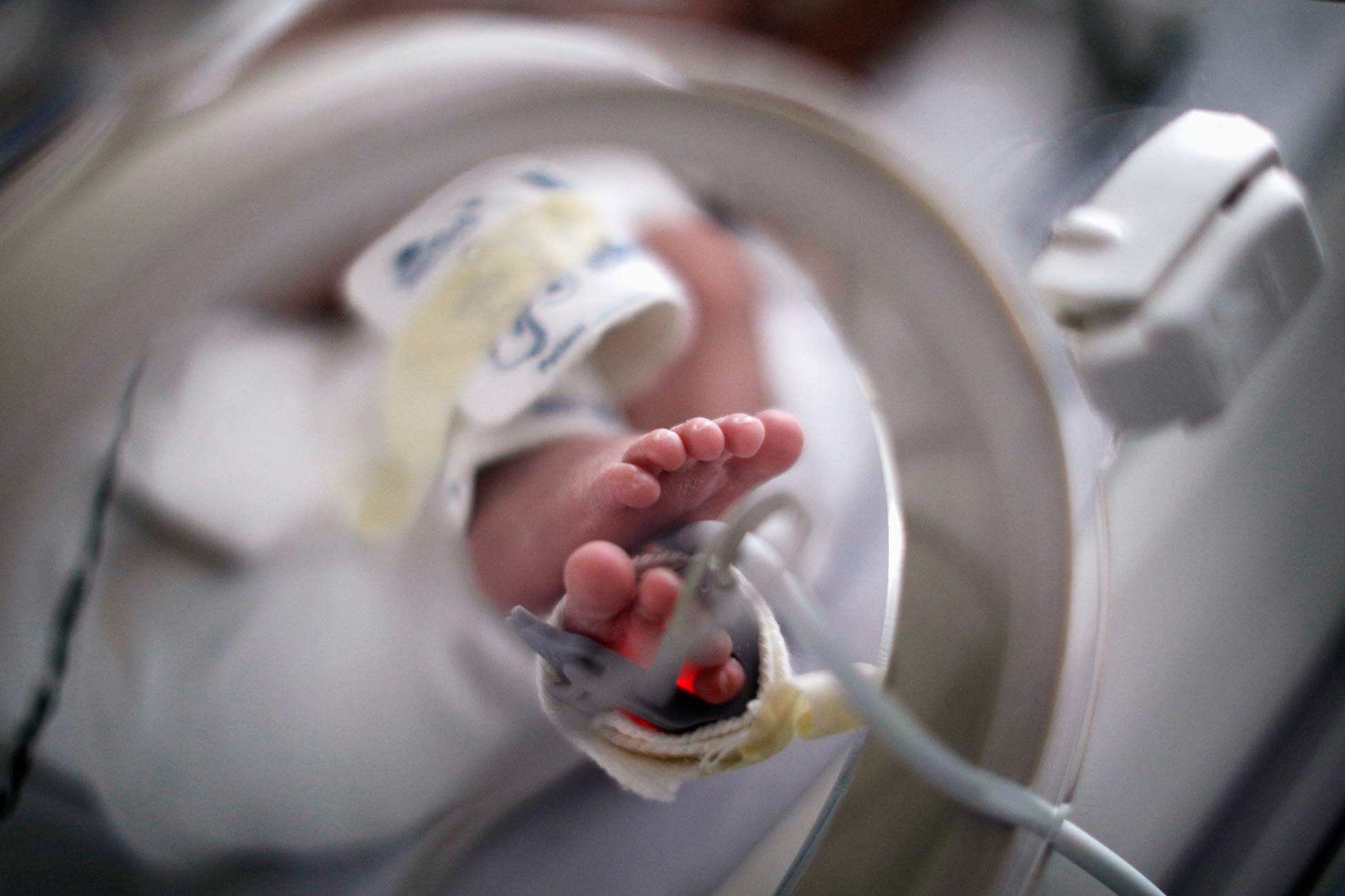 The feet of a newborn baby infected with the coronavirus disease (COVID-19), lying in an incubator, are pictured at the coronavirus neo-natal unit of the Maternal Perinatal Hospital 'Monica Pretelini Saenz', in Toluca, Mexico February 4, 2021. REUTERS/Luis Cortes