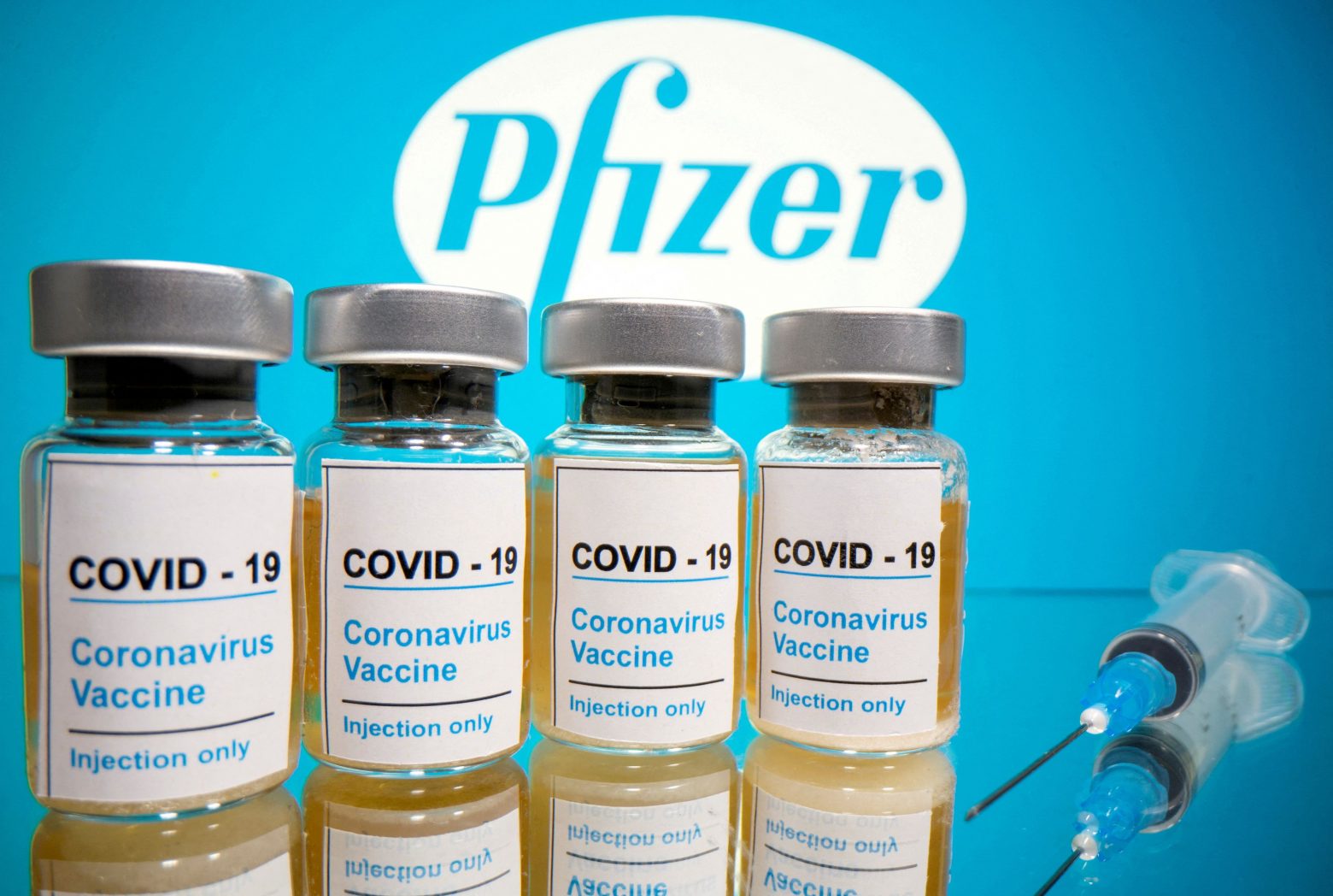 2022-01-25T013901Z_1692386803_RC216S9TW81Z_RTRMADP_5_HEALTH-CORONAVIRUS-PFIZER-VACCINES