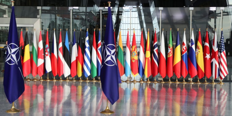 Flags are seen ahead of a NATO Defence Ministers meeting at the Alliance headquarters in Brussels, Belgium, October 21, 2021. REUTERS/Pascal Rossignol