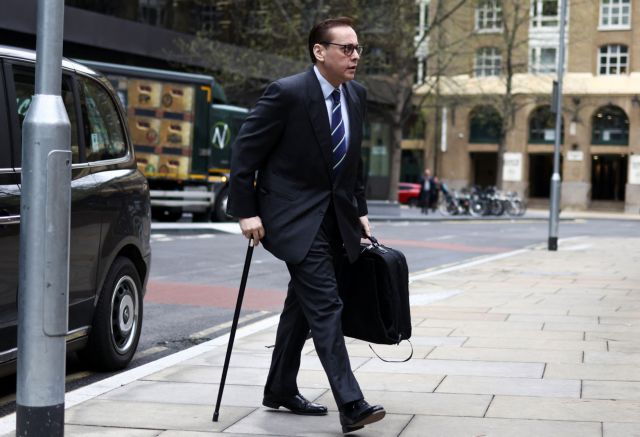 British MP Imran Ahmad Khan arrives at Southwark Crown Court to stand trial over a series of sex offence claims, in London, Britain, April 5, 2022. REUTERS/Tom Nicholson