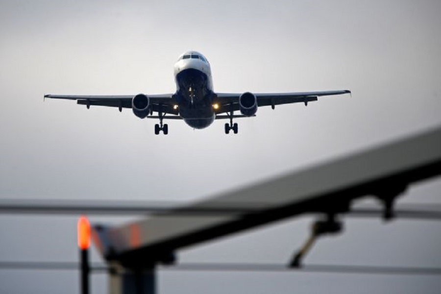 An airplane prepares to land at Cointrin airport in Geneva