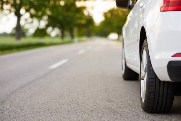 White car standing on the road with copy space