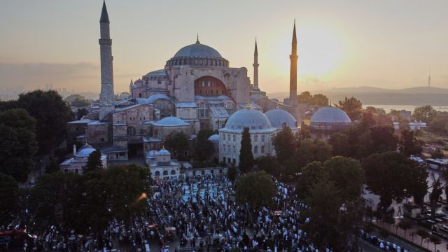 Muslims pray on the first day of Eid al-Adha, in Istanbul