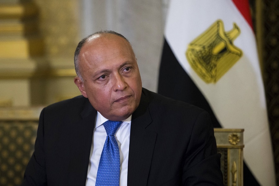 Egyptian Foreign Minister Sameh Shukri looks at his French counterpart Jean-Yves Le Drian in Paris, Tuesday Oct. 24, 2017. Egyptian President Abdel-Fattah el-Sissi met with French President Emmanuel Macron on as part of a three-day visit to France focusing on economic cooperation and the fight against extremism. (AP Photo/Kamil Zihnioglu, Pool)