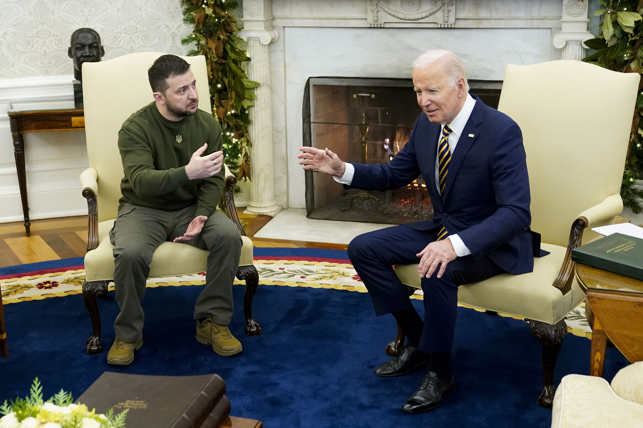 President Joe Biden speaks with Ukrainian President Volodymyr Zelenskyy as they meet in the Oval Office of the White House, Wednesday, Dec. 21, 2022, in Washington. (AP Photo/Patrick Semansky)