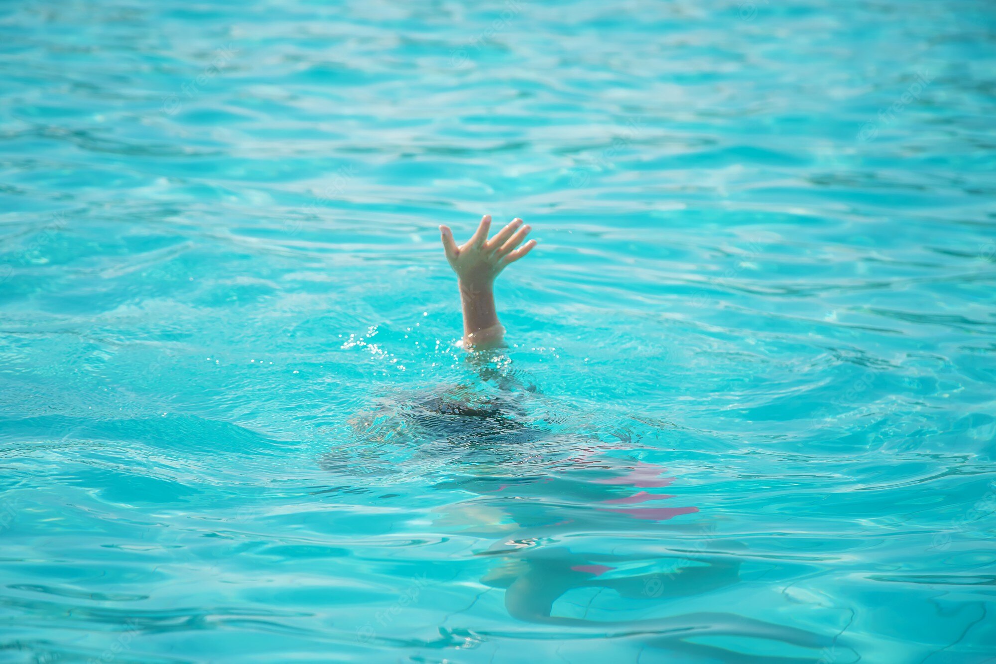 kid-is-drowning-sea-selective-focus_73944-19977