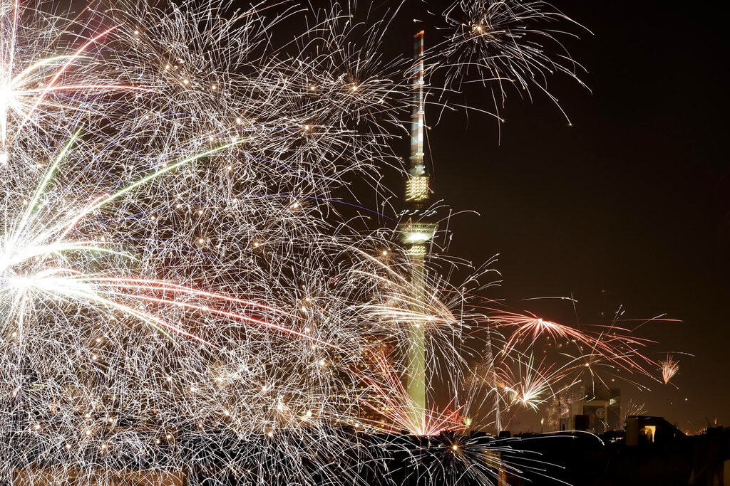 Fireworks explode in front of the Berlin TV Tower during New Year celebrations in Berlin, Germany, Sunday, Jan. 1, 2023. (AP Photo/Markus Schreiber)