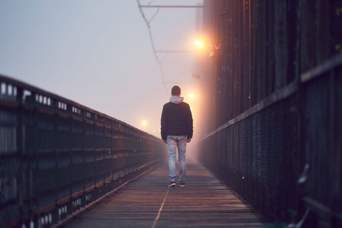 Sexoualiki-rear-view-of-man-on-footbridge-against-sky-royalty-free-image-887479208-1549376558-e1677334072256-1536x1024-696x464