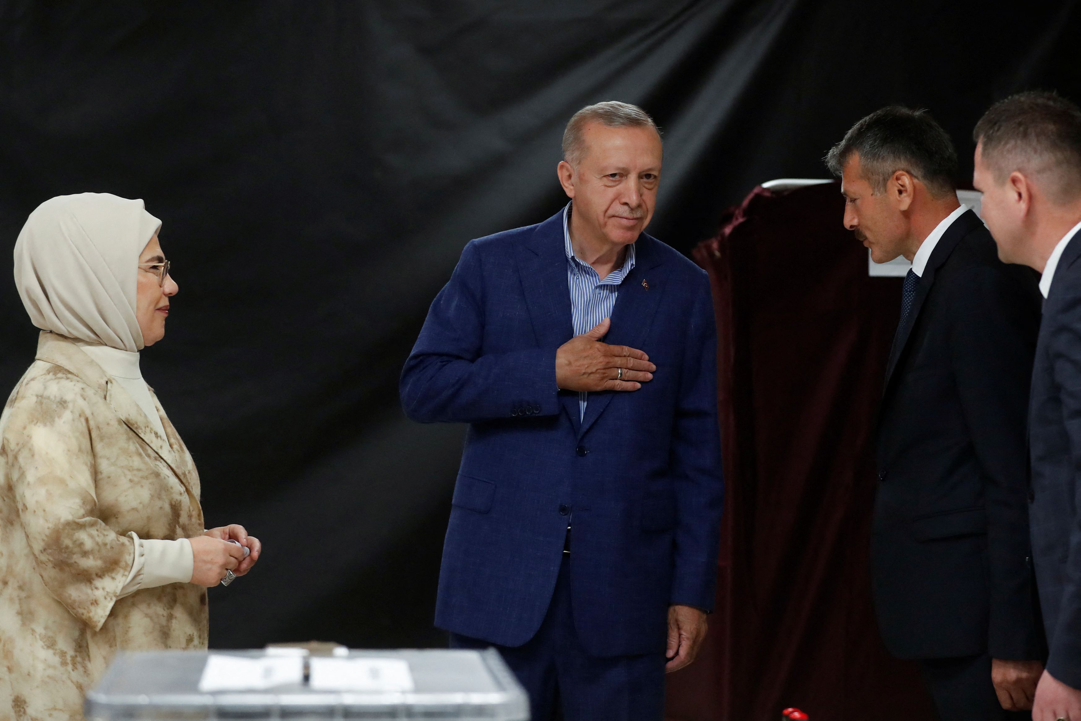 Turkish President Tayyip Erdogan and his wife Emine Erdogan vote at a polling station during the second round of the presidential election in Istanbul, Turkey May 28, 2023. REUTERS/Murad Sezer/Pool