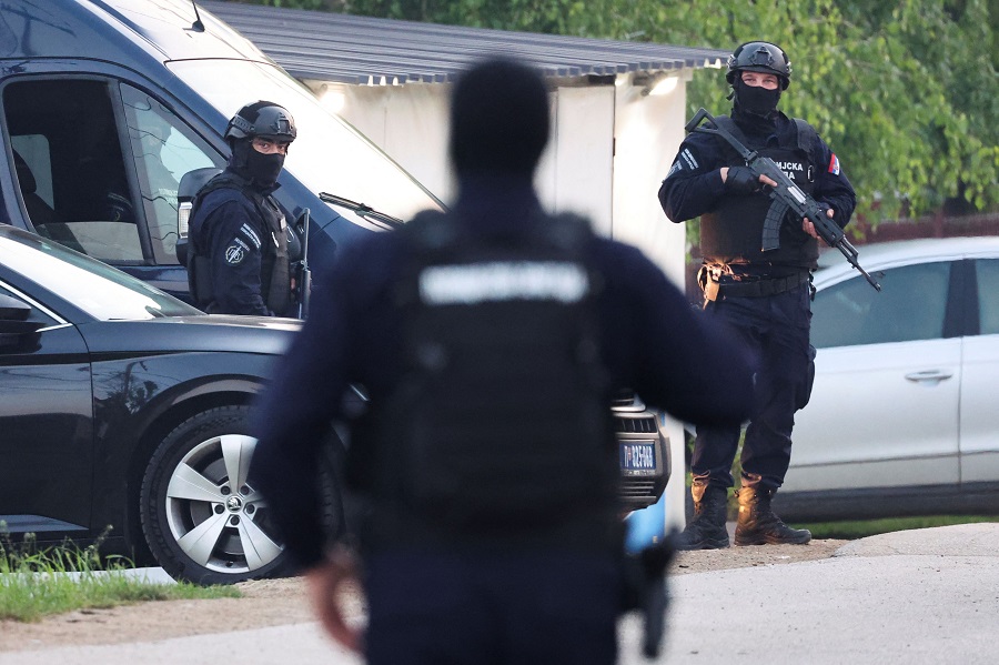 Security personnel operate, in the aftermath of a shooting, in Dubona, Serbia, May 5, 2023. REUTERS/Antonio Bronic