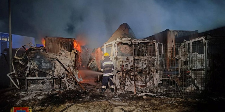 Firefighters work near damaged trucks following a Russian strike, amid Russia's attack on Ukraine, at a location given as Odesa region, Ukraine, in this handout picture released September 26, 2023. Odesa Regional Military Administration/Handout via REUTERS   THIS IMAGE HAS BEEN SUPPLIED BY A THIRD PARTY NO RESALES. NO ARCHIVES MANDATORY CREDIT