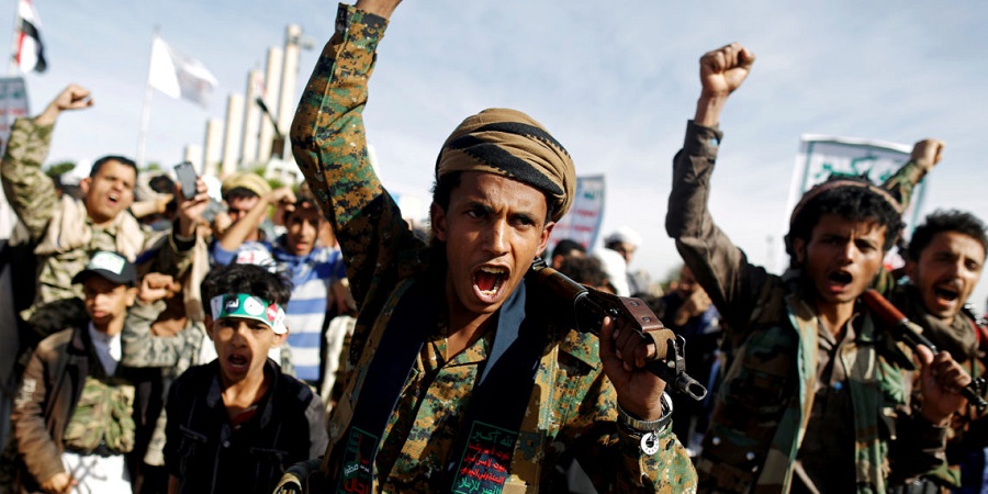 FILE PHOTO: Supporters of the Houthi movement shout slogans as they attend a rally to mark the 4th anniversary of the Saudi-led military intervention in Yemen's war, in Sanaa, Yemen March 26, 2019. REUTERS/Khaled Abdullah/File Photo