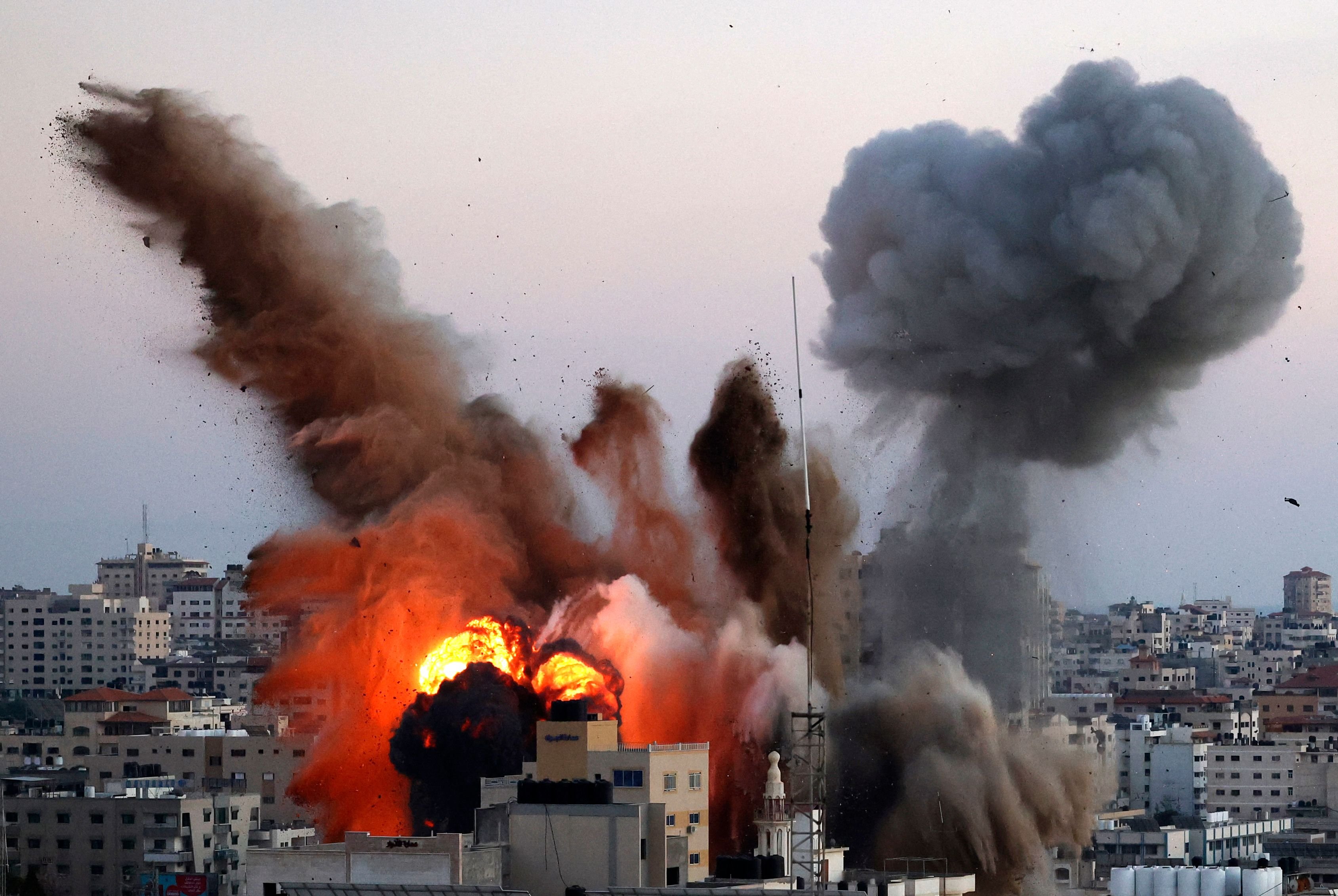 Smoke billows after an Israeli airstrike on Gaza City targeted the Ansar compound, linked to the Hamas movement, in the Gaza Strip on May 14, 2021. - Israel pounded Gaza and deployed extra troops to the border as Palestinians fired barrages of rockets back, with the death toll in the enclave on the fourth day of conflict climbing to over 100. (Photo by MAHMUD HAMS / AFP) (Photo by MAHMUD HAMS/AFP via Getty Images)