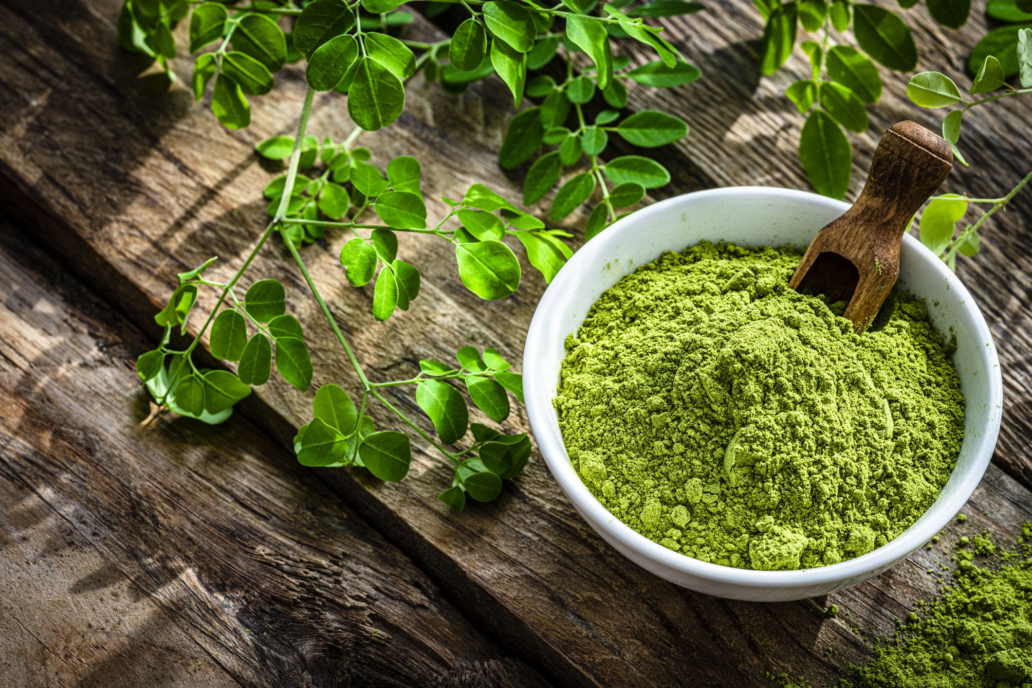 nutritional-supplement-moringa-powder-on-rustic-royalty-free-image-1659133952