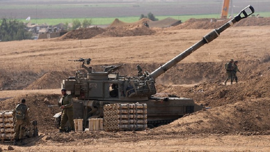 An Israeli mobile artillery unit is seen in a position near the Israel-Gaza border, Israel, Saturday, Oct. 28, 2023. Israel on Saturday expanded its ground operation in Gaza with infantry and armored vehicles backed by "massive" strikes from the air and sea, including the bombing of Hamas tunnels, a key target in its campaign to crush the territory's ruling group after its bloody incursion in Israel three weeks ago. (AP Photo/Ohad Zwigenberg)