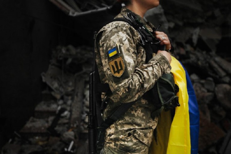 ukrainian-military-woman-with-ukrainian-flag-her-hands-background-exploded-house-