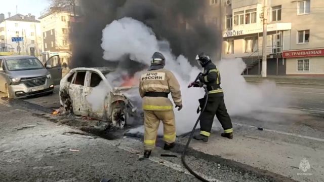 Firefighters extinguish a burning car following what was said to be Ukrainian forces' shelling in the course of Russia-Ukraine conflict, in Belgorod, Russia December 30, 2023, in this still image taken from video. Russian Emergencies Ministry/Handout via REUTERS ATTENTION EDITORS - THIS IMAGE HAS BEEN SUPPLIED BY A THIRD PARTY. NO RESALES. NO ARCHIVES. MANDATORY CREDIT.