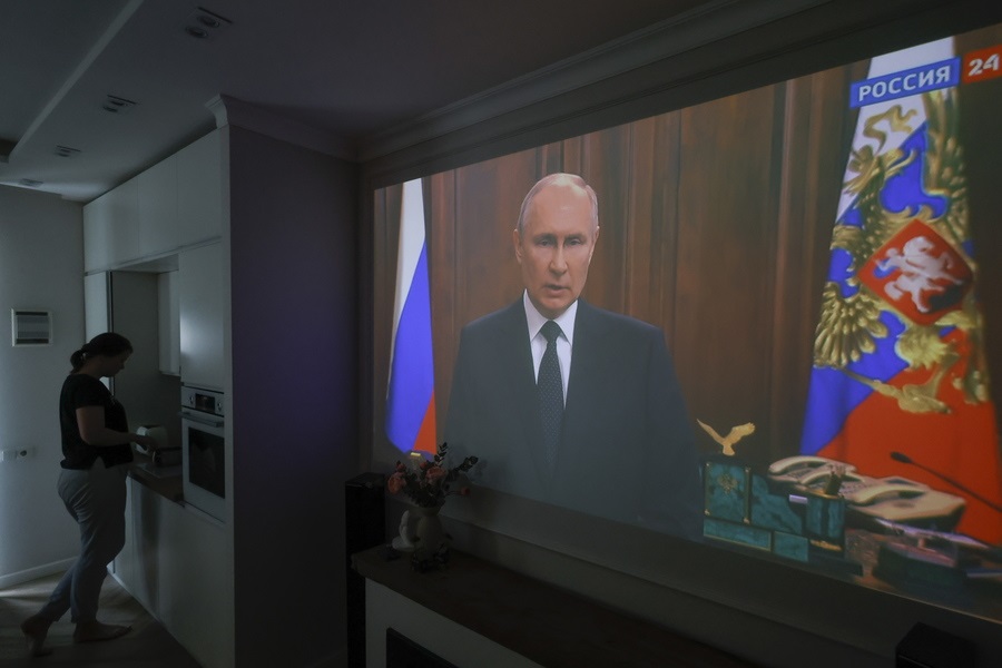 epa10709015 A screen shows Russian President Vladimir Putin delivering a televised address to the nation in Moscow, Russia, 24 June 2023. Putin said counter-terrorism measures were enforced in Moscow and other Russian regions. The speech came after private military company (PMC) Wagner Group’s chief Yevgeny Prigozhin said in a video on 24 June that his troops had occupied the building of the headquarters of the Southern Military District in Rostov-on-Don, demanding a meeting with Russia’s defense chiefs. Putin did not openly mention the Wagner Group nor its leader during the speech.  EPA/SERGEI ILNITSKY