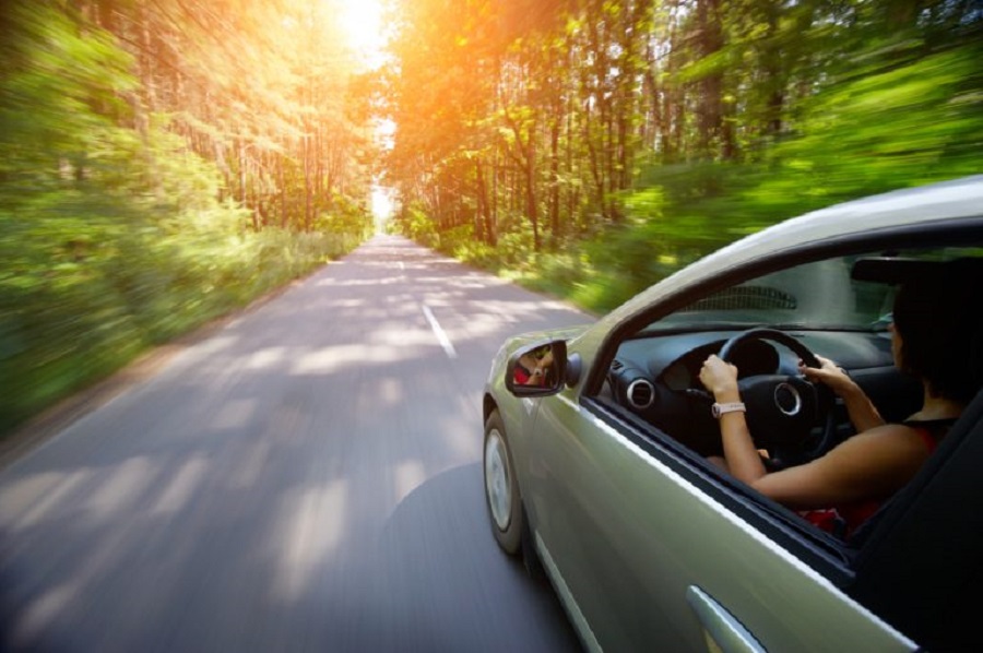 young-beautiful-woman-driving-car-rear-