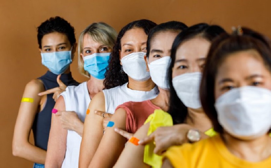 diverse-group-multinational-ethnic-female-patients-wears-face-mask-stand-line-by-height-order-look-camera-pointing-colorful-plasters-sh