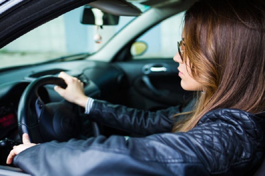 beautiful-young-woman-driving-her-car-