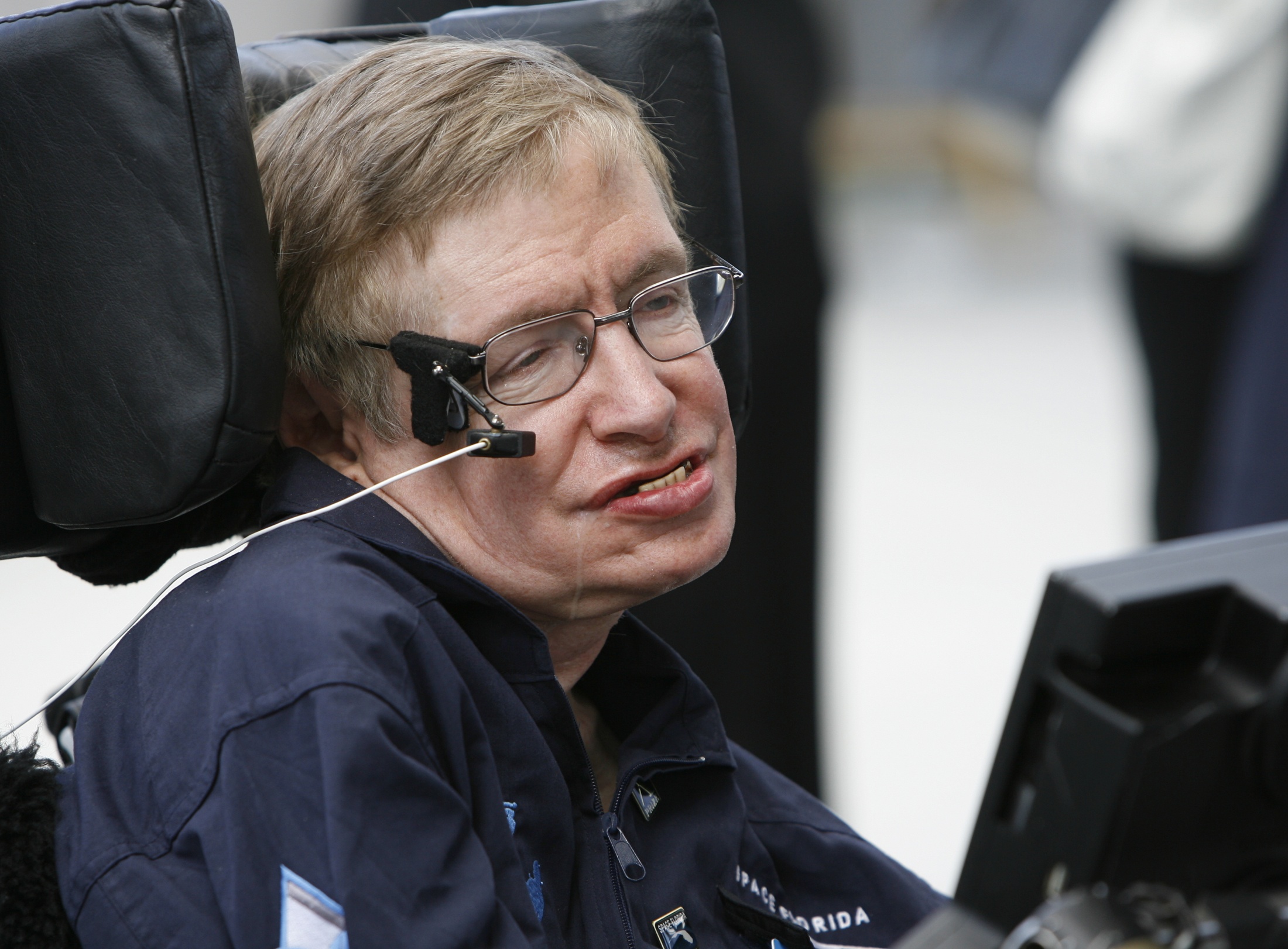 British cosmologist Stephen Hawking smiles as he answers questions about his up coming ZERO-G flight during an interview at Kennedy Space Center, Florida, April 26, 2007. Professor Hawking will fly weightless on the ZERO-G Experiment today, the flight will take off from the Shuttle Landing Facility at the Kennedy Space Center.  REUTERS/Charles W Luzier (UNITED STATES)