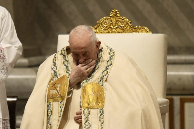 Pope Francis prays as he presides over the Easter vigil celebration in St. Peter's Basilica at the Vatican, Saturday, March 30, 2024. (AP Photo/Alessandra Tarantino)