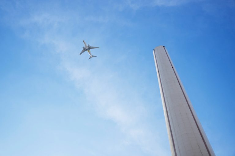 low-angle-tall-chimney-airplane-