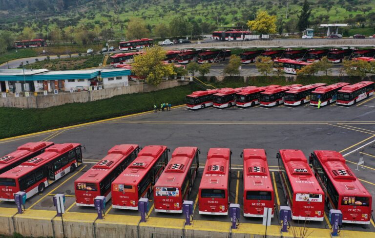 This aerial view shows Chinese-made buses at the Med Bus terminal in Santiago, on August 1, 2024. Chinese car manufacturers dominate the Chilean market, considered the most competitive in the world with eighty brands from 28 origins, being that Chinese cars already account for almost 40% of the booming automotive market. (Photo by RODRIGO ARANGUA / AFP)