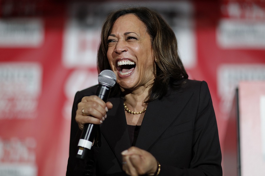 FILE - In this Nov. 8, 2019, file photo, then-Democratic presidential candidate Sen. Kamala Harris, D-Calif., reacts as she speaks at a town hall event at the Culinary Workers Union in Las Vegas. Democratic presidential candidate former Vice President Joe Biden has chosen  Harris as his running mate. (AP Photo/John Locher, File)