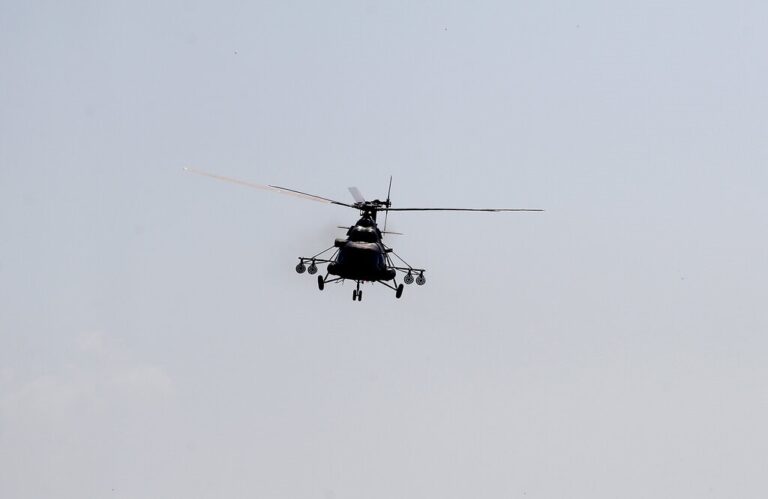 A Serbian army helicopter MI-171 performs during military exercises over Batajnica, military airport near Belgrade, Serbia, Friday, Aug. 21, 2020. The Russian and Chinese arming of Serbia, as well as their growing political and economic influence in the Balkan state, is being watched with unease in the West and among Serbia's neighbors. (AP Photo/Darko Vojinovic)