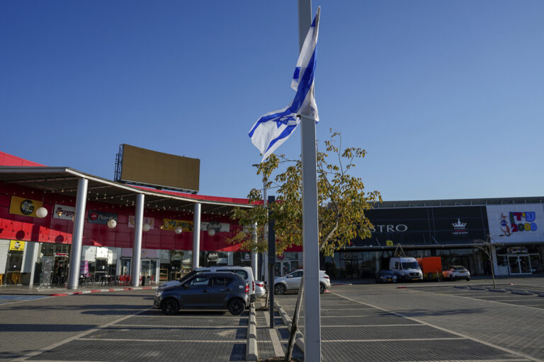 Cars parked at a closed shopping center due to the Israel-Hamas war, in Sderot, Israel, Sunday, Feb. 11, 2024. Moody's dropped the rating on Israel's debt on Friday, warning that the ongoing war in Gaza and a possible war in the north with Hezbollah could adversely affect Israel's economy. (AP Photo/Ariel Schalit)