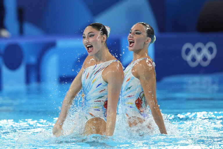 Greece's Sofia Evangelia Malkogeorgou and Evangelia Platanioti compete in the duet technical routine of artistic swimming at the 2024 Summer Olympics, Friday, Aug. 9, 2024, in Saint-Denis, France. (AP Photo/Lee Jin-man)