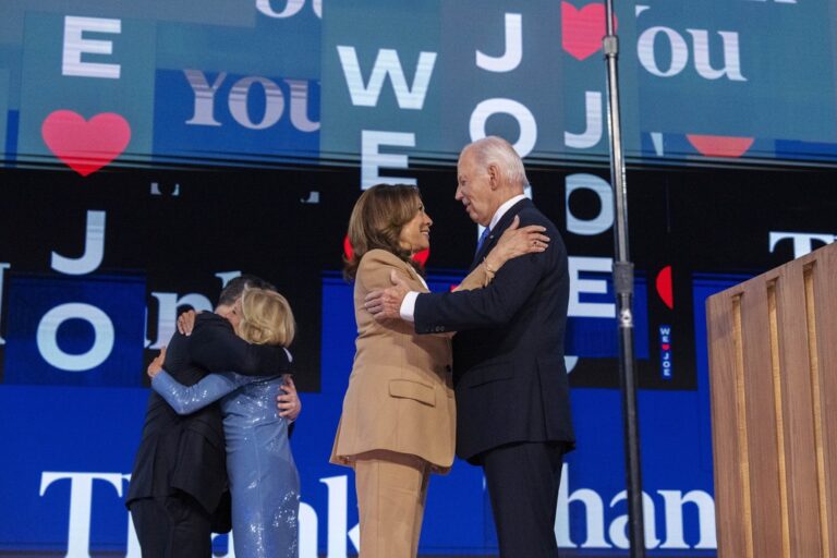 Democratic presidential nominee Vice President Kamala Harris, center, is hugged by President Joe Biden, as Doug Emhoff and first lady Jill Biden hug at left, after Biden's speech at the Democratic National Convention, Monday, Aug. 19, 2024, in Chicago. (AP Photo/Jacquelyn Martin)